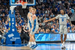 Creighton Bluejays Ty Davis celebrates after an Isaac Traudt made three during a college basketball game against the UNLV Rebels on December 7th, 2024 in Omaha Nebraska. Photo by Brandon Tiedemann.