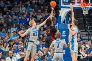 Creighton Bluejays Jackson McAndrews and Ryan Kalkbrenner contest a shot during a college basketball game against the UNLV Rebels on December 7th, 2024 in Omaha Nebraska. Photo by Brandon Tiedemann.