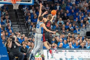 Creighton Bluejays Mason Miller contests a shot during a college basketball game against the UNLV Rebels on December 7th, 2024 in Omaha Nebraska. Photo by Brandon Tiedemann.