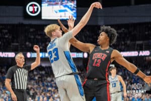 Creighton Bluejays Jackson McAndrews shoots a contest jumper during a college basketball game against the UNLV Rebels on December 7th, 2024 in Omaha Nebraska. Photo by Brandon Tiedemann.