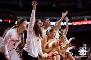 Nebraska Cornhuskers bench celebrates a lay up against the Minnesota Golden Gophers in the second half during a college basketball game Sunday, December 8, 2024, in Lincoln, Nebraska. Photo by John S. Peterson.