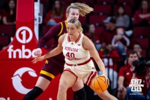 Nebraska Cornhuskers center Alexis Markowski (40) drives to the basket against Minnesota Golden Gophers center Sophie Hart (52) during a college basketball game Sunday, December 8, 2024, in Lincoln, Nebraska. Photo by John S. Peterson.
