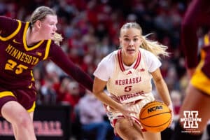 Nebraska Cornhuskers guard Alberte Rimdal (5) drives to the basket against Minnesota Golden Gophers guard Grace Grocholski (25) in the first half during a college basketball game Sunday, December 8, 2024, in Lincoln, Nebraska. Photo by John S. Peterson.