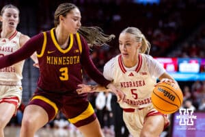Nebraska Cornhuskers guard Alberte Rimdal (5) drives to the basket against Minnesota Golden Gophers guard Amaya Battle (3) in the first half during a college basketball game Sunday, December 8, 2024, in Lincoln, Nebraska. Photo by John S. Peterson.