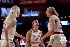 Nebraska Cornhuskers guard Logan Nissley (2) celebrates a basket by Alexis Markowski against the Minnesota Golden Gophers during a college basketball game Sunday, December 8, 2024, in Lincoln, Nebraska. Photo by John S. Peterson.