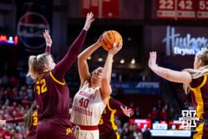 Nebraska Cornhuskers center Alexis Markowski (40) attempts a lay up against Minnesota Golden Gophers center Sophie Hart (52) during a college basketball game Sunday, December 8, 2024, in Lincoln, Nebraska. Photo by John S. Peterson.