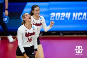 Nebraska Cornhuskers middle blocker Andi Jackson (15) with Bergen Reilly celebrates scoring a point against the Florida A&M Rattlers in the second set during the first round of the NCAA volleyball tournament Friday, December 6, 2024, in Lincoln, Nebraska. Photo by John S. Peterson.