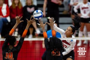 Nebraska Cornhuskers outside hitter Harper Murray (27) spikes the ball against Florida A&M Rattlers middle hitter Isis Williams (10) and middle hitter Milana Thornton (22) in the first set during the first round of the NCAA volleyball tournament Friday, December 6, 2024, in Lincoln, Nebraska. Photo by John S. Peterson.