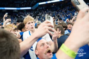 Creighton Bluejays Jackson McAndrews takes a photo with a fan after the win against the Kansas Jayhawk during a college basketball game on Wednesday, December 4th, 2024, in Omaha Nebraska. Photo by Brandon Tiedemann.