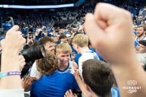 Creighton Bluejays Ty Davis embraces fans after the win against the Kansas Jayhawk during a college basketball game on Wednesday, December 4th, 2024, in Omaha Nebraska. Photo by Brandon Tiedemann.