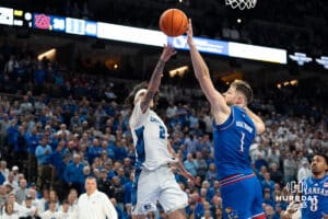Creighton Bluejays Pop Isaac makes a layup against the Kansas Jayhawk during a college basketball game on Wednesday, December 4th, 2024, in Omaha Nebraska. Photo by Brandon Tiedemann.