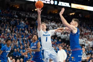 Creighton Bluejays Steven Ashworth attempts a layup against the Kansas Jayhawk during a college basketball game on Wednesday, December 4th, 2024, in Omaha Nebraska. Photo by Brandon Tiedemann.