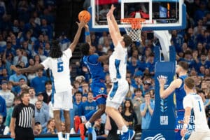 Creighton Bluejays Ryan Kalkbrenner contests a shot against the Kansas Jayhawk during a college basketball game on Wednesday, December 4th, 2024, in Omaha Nebraska. Photo by Brandon Tiedemann.