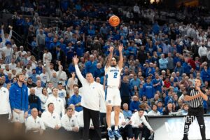 Creighton Bluejays Pop Isaac shoots a three against the Kansas Jayhawks during a college basketball game on Wednesday, December 4th, 2024 in Omaha Nebraska. Photo by Brandon Tiedemann.