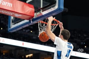 Ryan Kalkbrenner dunks against the Kansas Jayhawks during a college basketball game on Wednesday, December 4th, 2024, in Omaha Nebraska. Photo by Brandon Tiedemann.
