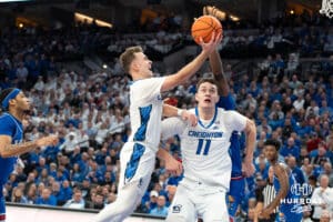 Creighton Bluejays Steven Ashworth goes up for a layup against the Kansas Jayhawks during a college basketball game on Wednesday, December 4th, 2024 in Omaha Nebraska. Photo by Brandon Tiedemann.