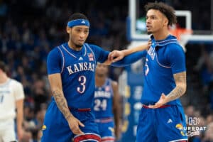 Kansas Jayhawks Zeke Mayo being held back during a college basketball game against the Creighton Bluejays Wedensday, December 5th, 2024 in Omaha Nebraska. Photo by Brandon Tiedemann.