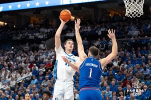 Creighton Bluejay center Ryan Kalkbrenner (11) makes a jump shot against the Kansas Jayhawks in the first half during a college basketball game on Wednesday, December 4th, 2024, in Omaha, Nebraska. Photo by Brandon Tiedemann.