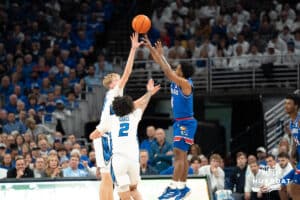 Creighton Bluejays Jackson McAndrews and Pop Isaacs contest a shot during a college basketball game on Wednesday, December 4th, 2024 in Omaha Nebraska. Photo by Brandon Tiedemann.