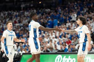 Creighton Bluejays Fredrick King and Pop Isaacs highfive during a college basketball game on December 4th, 2024 in Omaha Nebraska. Photo by Brandon Tiedemann.