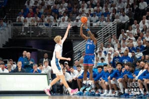 Creighton Bluejays Jackson McAndrews contests a jumper during a college basketball game on December 4th, 2024 in Omaha Nebraska. Photo by Brandon Tiedemann.