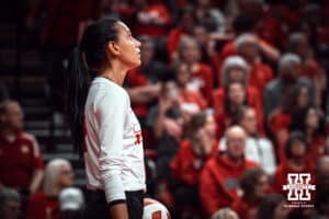 Nebraska Cornhusker outside hitter Harper Murray (27) readies to serve celebrates a point against the Indiana Hoosiers during a college volleyball game on Nov 16, 2024 in Lincoln, Nebraska. Photo by Logan Hock