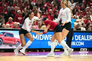 Nebraska Cornhusker outside hitter Harper Murray (27), Lexi Rodriguez, and Leyla Blackwell celebrate celebrates a point against the Indiana Hoosiers during a college volleyball game on Nov 16, 2024 in Lincoln, Nebraska. Photo by Logan Hock