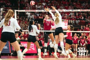Nebraska Cornhusker middle blocker Andi Jackson (15) jumps to try and block against the Indiana Hoosiers during a college volleyball game on Nov 16, 2024 in Lincoln, Nebraska. Photo by Logan Hock