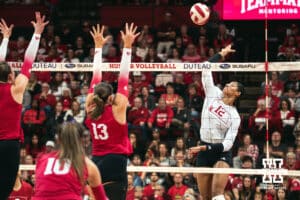 Nebraska Cornhusker outside hitter Taylor Landfair (12) spikes the ball against the Indiana Hoosiers during a college volleyball game on Nov 16, 2024 in Lincoln, Nebraska. Photo by Logan Hock
