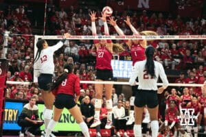 Nebraska Cornhusker outside hitter Taylor Landfair (12) spikes the ball against the Indiana Hoosiers during a college volleyball game on Nov 16, 2024 in Lincoln, Nebraska. Photo by Logan Hock