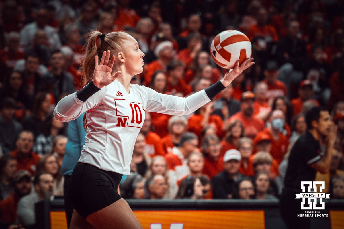 Nebraska Cornhusker libero/defensive specialist Olivia Mauch (10) serves the ball against the Indiana Hoosiers during a college volleyball game on Nov 16, 2024 in Lincoln, Nebraska. Photo by Logan Hock