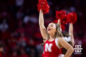Nebraska Cornhuskers cheerleader leading Go Big Red at a break in the action against the North Florida Ospreys in the second half during a college basketball game Sunday, December 1, 2024, in Lincoln, Nebraska. Photo by John S. Peterson.
