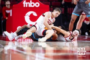 Nebraska Cornhuskers guard Cale Jacobsen (31) and guard Sam Hoiberg (1) scramble to get the ball against the North Florida Ospreys in the second half during a college basketball game Sunday, December 1, 2024, in Lincoln, Nebraska. Photo by John S. Peterson.