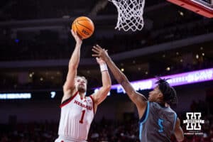 Nebraska Cornhuskers guard Sam Hoiberg (1) makes a layup against North Florida Ospreys guard Dante Oliver (5) in the second half during a college basketball game Sunday, December 1, 2024, in Lincoln, Nebraska. Photo by John S. Peterson.