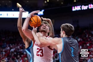Nebraska Cornhuskers forward Andrew Morgan (23) fouled going for a layup against North Florida Ospreys guard Nate Lliteras (2) in the second half during a college basketball game Sunday, December 1, 2024, in Lincoln, Nebraska. Photo by John S. Peterson.