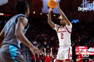 Nebraska Cornhuskers guard Ahron Ulis (2) makes a three-point shot against the North Florida Ospreys in the first half during a college basketball game Sunday, December 1, 2024, in Lincoln, Nebraska. Photo by John S. Peterson.