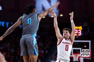 Nebraska Cornhuskers guard Connor Essegian (0) makes a three-point shot against Nebraska Cornhuskers guard Connor Essegian (0) in the first half during a college basketball game Sunday, December 1, 2024, in Lincoln, Nebraska. Photo by John S. Peterson.