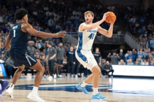 Creighton Bluejays Isaac Traudt looks to pass during a college basketball game against Xavier on January 29th, 2025 in Omaha Nebraska. Photo by Brandon Tiedemann.