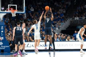 Creighton Bluejays Steven Ashworth contests a jumpshot during a college basketball game against Xavier on January 29th, 2025 in Omaha Nebraska. Photo by Brandon Tiedemann.