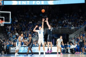 Creighton Bluejays Ryan Kalkbrenner contests a shot during a college basketball game against Xavier on January 29th, 2025 in Omaha Nebraska. Photo by Brandon Tiedemann.
