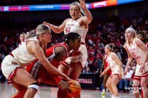 Nebraska Cornhuskers forward Jessica Petrie (12) reaches for the ball against Ohio State Buckeyes forward Ajae Petty (1) in the the first quarter during a college basketball game, Sunday, January 26, 2025, in Lincoln, Nebraska. Photo by John S. Peterson.
