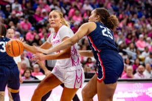 Creighton Bluejays forward Mallory Brake (14) drives to the basket against UConn Huskies forward Ice Brady (25) in the third quarter during a college basketball game, Saturday, January 25, 2025, in Omaha, Nebraska. Photo by John S. Peterson.