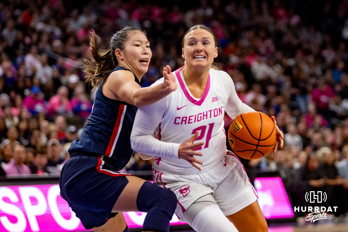 Creighton Bluejays guard Molly Mogensen (21) drives to the basket against UConn Huskies guard Kaitlyn Chen (20) in the third quarter during a college basketball game, Saturday, January 25, 2025, in Omaha, Nebraska. Photo by John S. Peterson.
