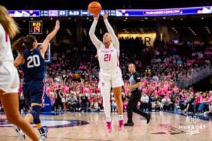 Creighton Bluejays guard Molly Mogensen (21) makes a three-point shot against UConn Huskies guard Kaitlyn Chen (20) in the third quarter during a college basketball game, Saturday, January 25, 2025, in Omaha, Nebraska. Photo by John S. Peterson.