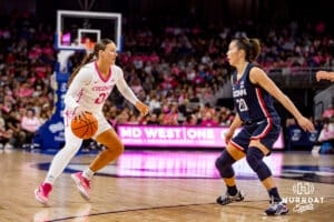Creighton Bluejays guard Molly Mogensen (21) dribbles the ball against UConn Huskies guard Kaitlyn Chen (20) in the first quarter during a college basketball game, Saturday, January 25, 2025, in Omaha, Nebraska. Photo by John S. Peterson.