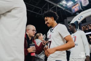 Omaha Maverick Lance Waddles talks with a fan postgame during a basketball game at Baxter Arena on January 23rd, 2025 in Omaha Nebraska. Photo by Collin Stilen.