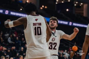 Omaha Maverick Tony Osburn and Marquel Sutton celebrate after the basketball game at Baxter Arena on January 23rd, 2025 in Omaha Nebraska. Photo by Collin Stilen.