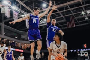 Omaha Maverick Lance Waddles gets a double jump after faking a shot during a basketball game at Baxter Arena on January 23rd, 2025 in Omaha Nebraska. Photo by Collin Stilen.