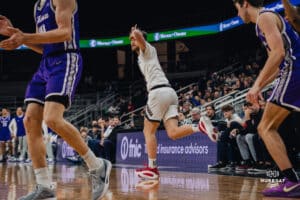 Omaha Maverick Tony Osburn celebrates with the "L" to the forehead against St. Thomas during a basketball game at Baxter Arena on January 23rd, 2025 in Omaha Nebraska. Photo by Collin Stilen.