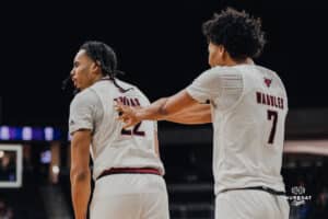 Omaha Maverick Lance Waddles gives teammate Kamryn Thomas a push after an exciting play during a basketball game at Baxter Arena on January 23rd, 2025 in Omaha Nebraska. Photo by Collin Stilen.